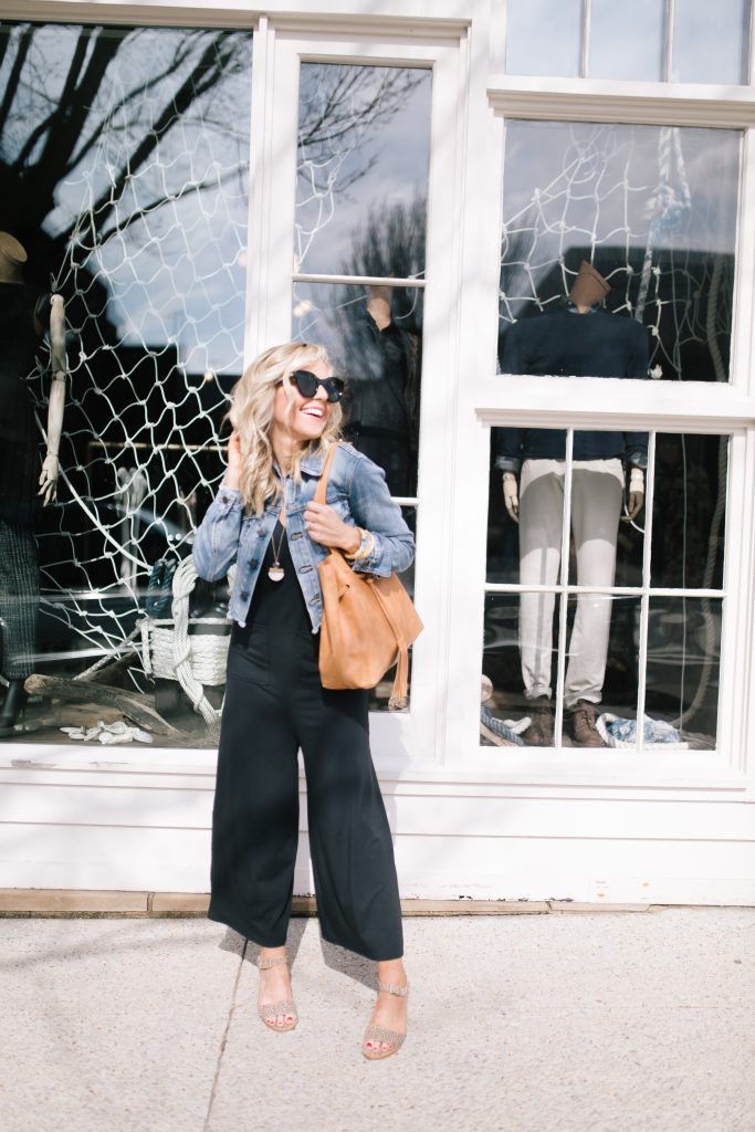 ABLE featured by top US fashion blog Hello! Happiness; Image of a woman wearing a black jumpsuit from ABLE
