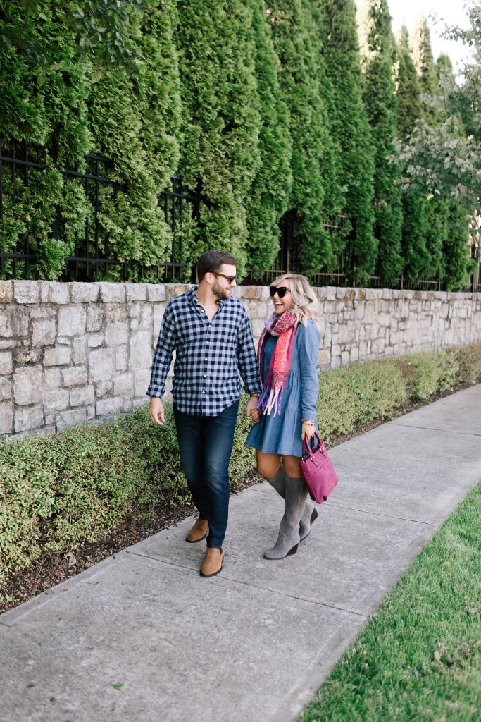 Date Night Outfit Ideas Done Right | Bonobos Style by popular Nashville fashion blog, Hello Happiness: image of a man walking with his wife outside and wearing a Bonobos button down shirt, Bonobos Stretch Eco Jeans and Bonobos The Alpern Chelsea Boot.