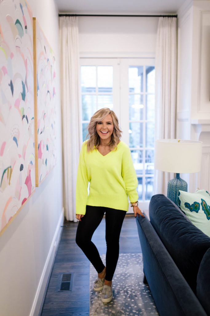 Scoop it Up... The Best in Walmart Sweaters! by popular Nashville fashion blog, Hello Happiness: image of a woman outside wearing a Walmart Scoop Slouchy V-Neck Sweater, Walmart J Slides Aztec Bronze Metallic Leather Loafer Tassel Sneaker, and Walmart Spanx Women's Seamless Side Zip Leggings.