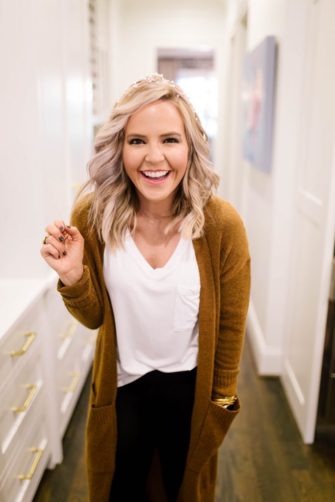 Scoop it Up... The Best in Walmart Sweaters! by popular Nashville fashion blog, Hello Happiness: image of a woman outside wearing a Walmart Scoop Patch Pocket Duster Sweater, Walmart white pocket t-shirt, Walmart J Slides Aztec Bronze Metallic Leather Loafer Tassel Sneaker, and Walmart Spanx Women's Seamless Side Zip Leggings.