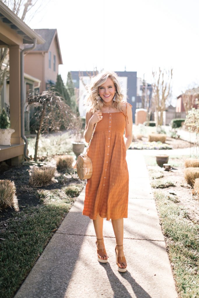 Festival Outfit Ideas featured by top US fashion blog Hello! Happiness; Image of a woman wearing AE button down dress, Amazon bag, Steve Sirena wedges and Able denim jacket.