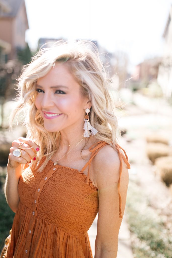 Festival Outfit Ideas featured by top US fashion blog Hello! Happiness; Image of a woman wearing AE button down dress, Amazon bag, Steve Sirena wedges and Able denim jacket.