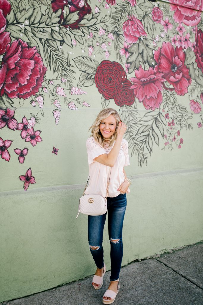 Thoughtful Mother's Day Gifts featured by top US life and style blog Hello! Happiness; Image of a woman wearing a J.Crew white blouse and AE jeans.