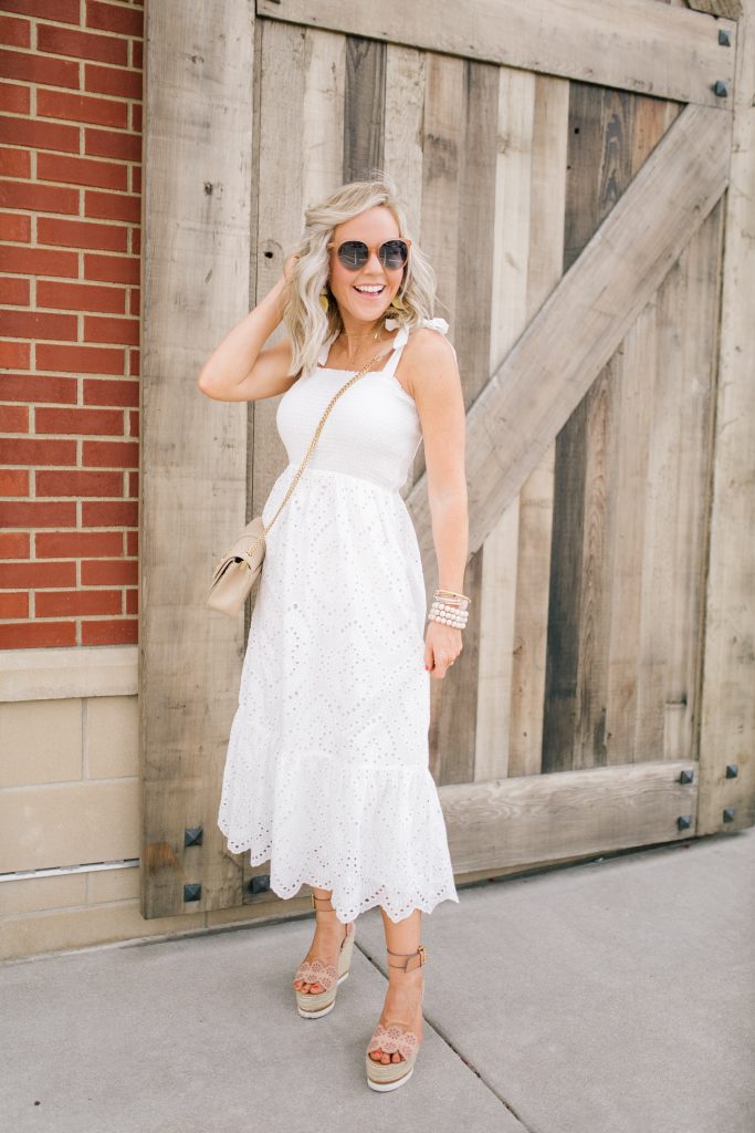 Pretty Pink Lily Favorites...by popular Nashville fashion blog, Hello Happiness: image of a woman wearing a Pink Lily Promise in My Heart Dress, Sulpice Small Crossbody, and Willa Ford Pink and Yellow Geometric Earrings.
