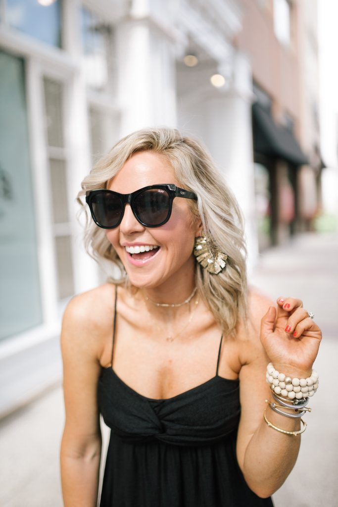 Friday Favs... Recent Shopbop Favorites + Obsessions by popular Nashville blog, Hello Happiness: image of a woman standing outside in front of a  white building and wearing a Shopbop Joie dress, Steve Madden Laurisa Tan Leather platform sandals, Elie and Jane 3PCS - Wood Ball Ribbon Stretchable Bracelets​, Indie Mae The Tropics earrings, and holding an Elie and Jane tote. 