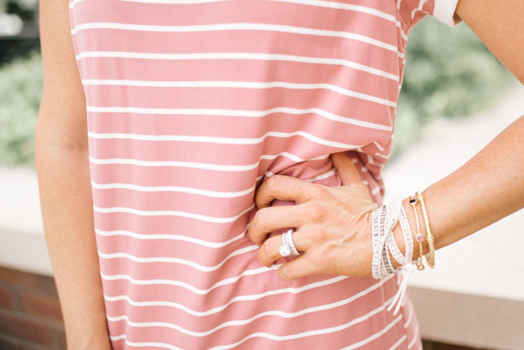 Pretty Pink Lily Favorites...by popular Nashville fashion blog, Hello Happiness: image of a woman wearing a Pink Lily Blissful Days Striped Dress, Marmont Crossbody, The Natalie Snakeskin Print Sneakers, Indie Mae The Layla earrings, Silver Dorado Wrap Bracelets, and Julie Vos MILANO BANGLE.