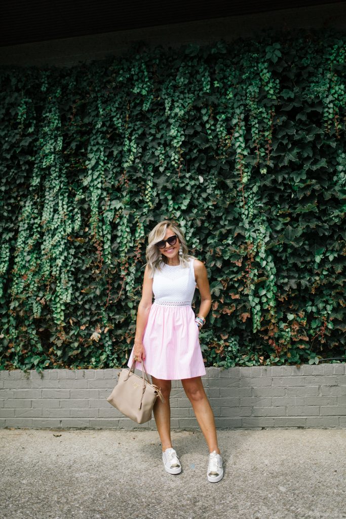The Lilly Pulitzer After Party Sale is LIVE! by popular Nashville fashion blog, Hello Happiness: image of a woman wearing a Lilly Pulitzer Alivia Dress and NERO GIARDINI sneakers.
