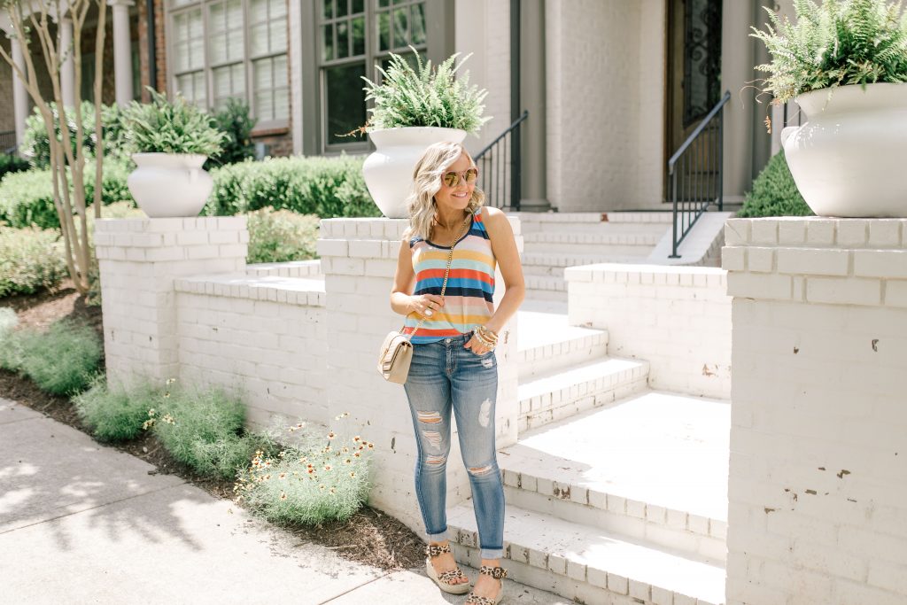 Evereve Summer Collection featured by top US fashion blog Hello! Happiness; Image of a woman wearing Evereve striped tank and Evereve jeans.