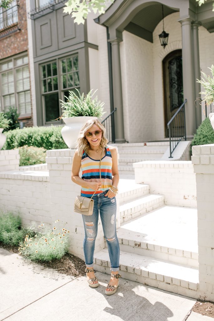 Evereve Summer Collection featured by top US fashion blog Hello! Happiness; Image of a woman wearing Evereve striped tank and Evereve jeans.