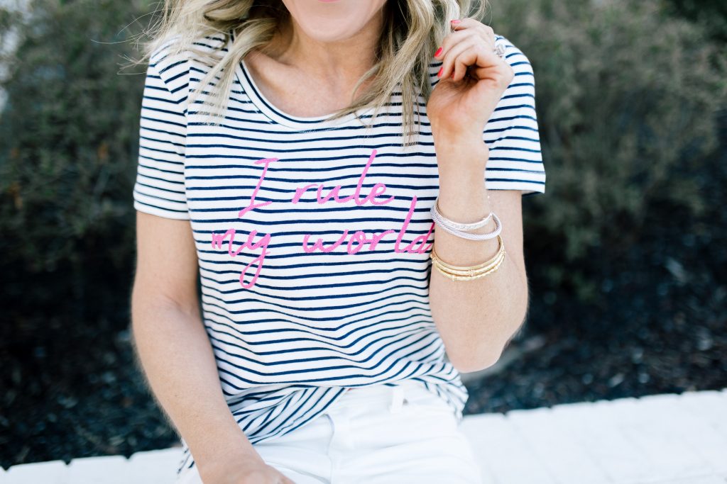 Walmart EV1 featured by top US fashion blog Hello! Happiness; Image of a woman wearing a striped shirt, white skinny jeans and slip on shoes from Walmart.