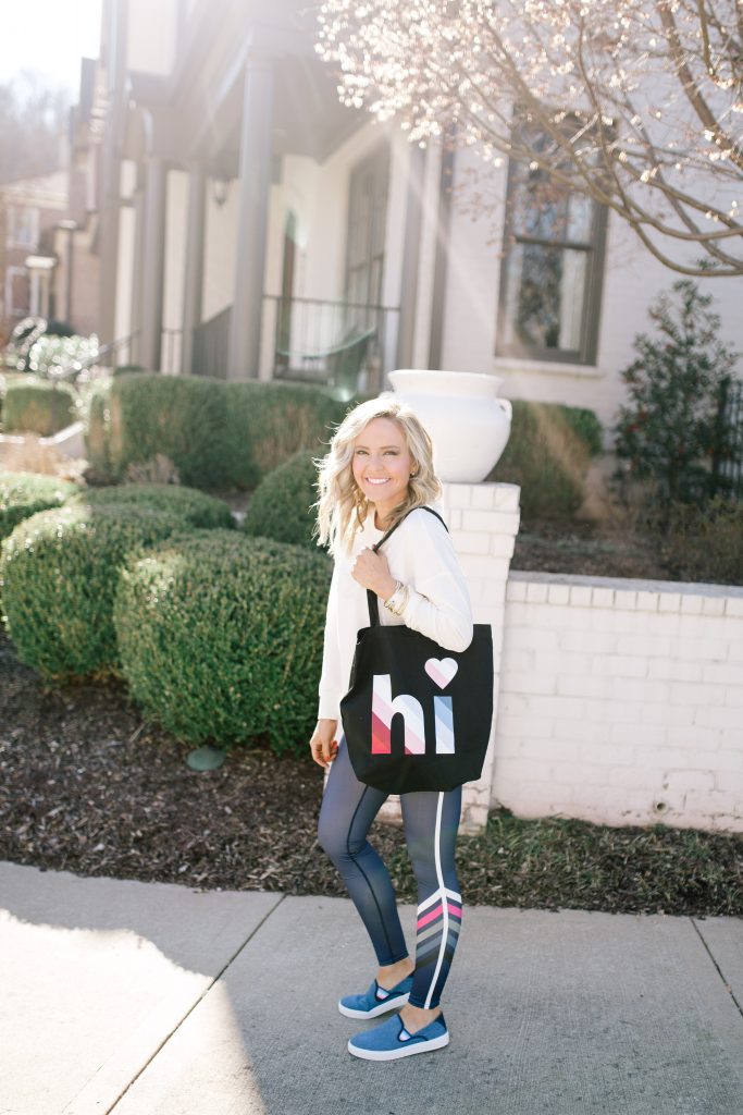 Walmart EV1 featured by top US fashion blog Hello! Happiness; Image of a woman wearing striped leggings and a sweatshirt from Walmart.