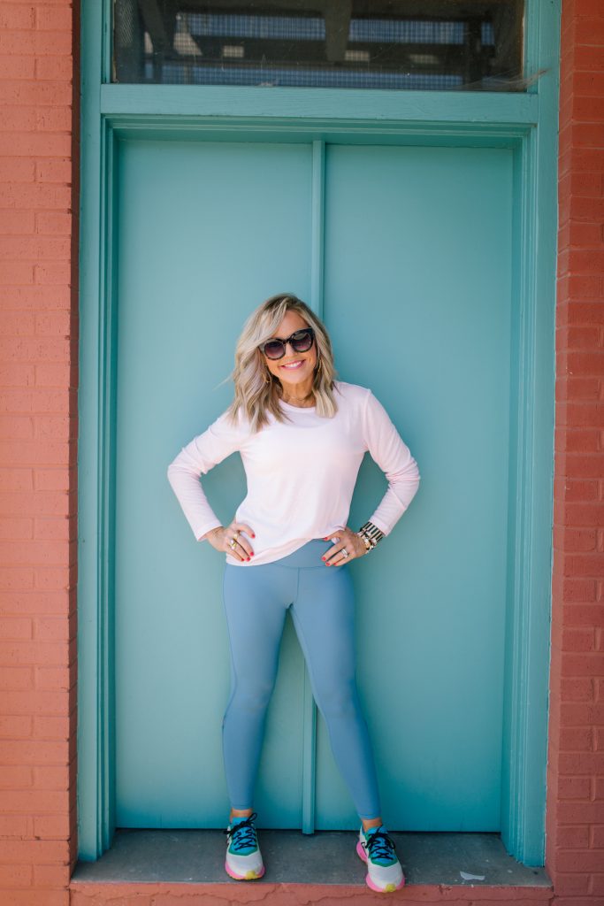 Intermittent Fasting Challenge... A Little Q&A by popular Nashville life and style blog, Hello Happiness: image of a woman standing outside and wearing Core 10 Women's (XS-3X) High Waist Yoga Lattice 7/8 Crop Legging - 24", Amazon Brand - Core 10 Women's Lightweight Semi-Sheer Rib Knit Yoga Backless Long Sleeve Workout Top, Nike Women's Air Zoom Pegasus 36 Trail Running Shoes, and holding a Claire Bella Large Camo Green Tumbler, 