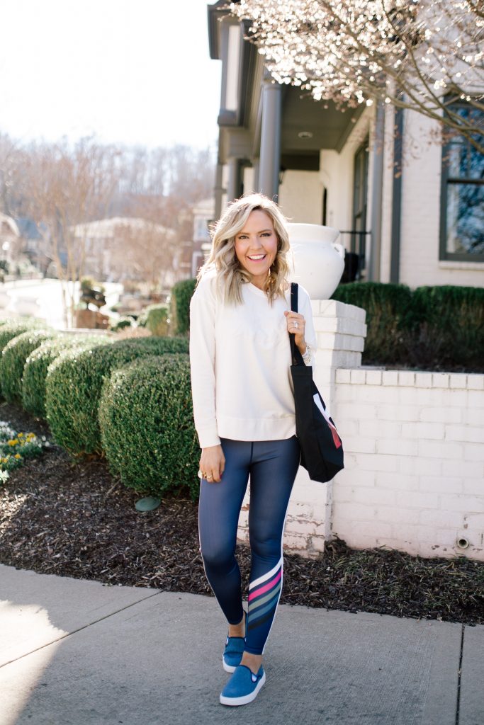 Walmart EV1 featured by top US fashion blog Hello! Happiness; Image of a woman wearing striped leggings and a sweatshirt from Walmart.
