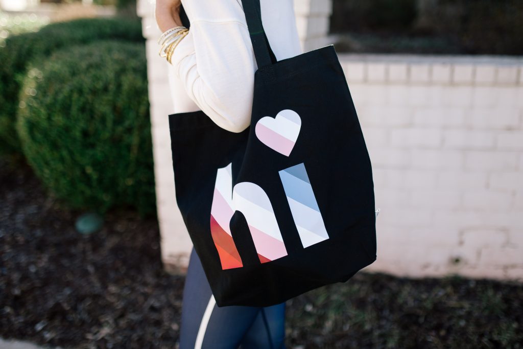 Walmart EV1 featured by top US fashion blog Hello! Happiness; Image of a woman wearing striped leggings and a sweatshirt from Walmart.
