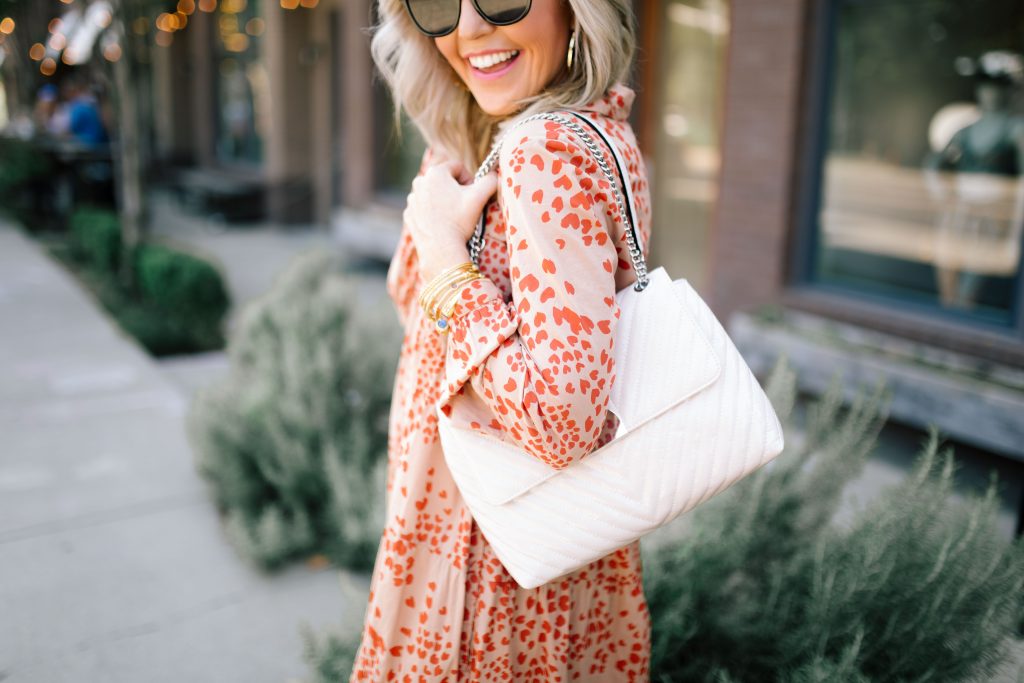 Fall Street Style with Marks and Spencer...by popular Nashville fashion blog, Hello Happiness: image of a woman standing outside of a restaurant and wearing a Marks and Spencer PER UNA Pure Cotton Printed Tiered Shirt Maxi Dress, Marks and Spencer M&S COLLECTION Leather Suede Panel Lace-up Trainers, and carrying a Marks and Spencer M&S COLLECTION Chain Detail Quilted Shoulder Bag. 