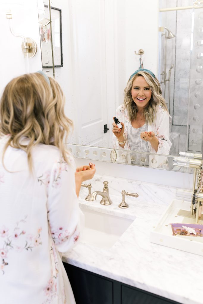 Dr Brandt Products featured by top US beauty blog Hello! Happiness; Image of a woman in her pajamas.