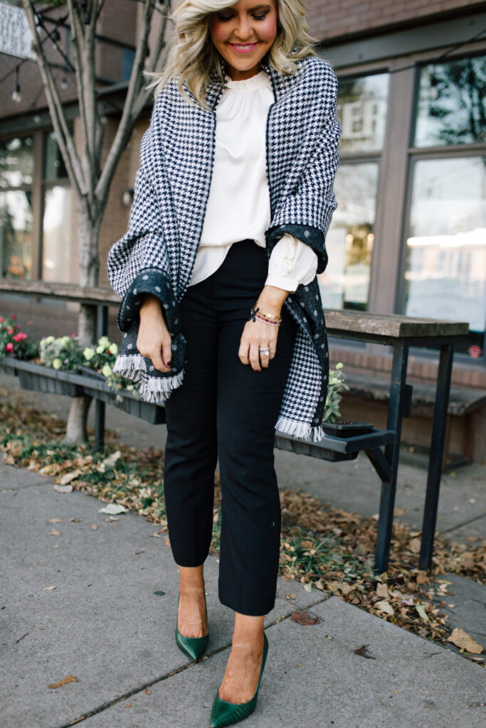 J. Crew Holiday by popular Nashville fashion blog, Hello Happiness: image of Natasha Stoneking standing outside and wearing a J. Crew double sided scarf, Ruffle Sleeve Top Satin Top in Crepe, Hayden Kick Out Crop Pant in Wool, Double Sided Scarf in Houndstooth Dot, and Green Embossed Leather Pumps.