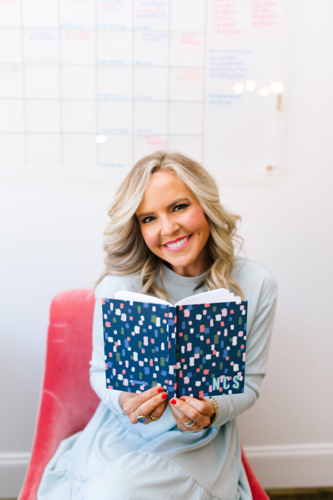 Clairebella Studio by popular Nashville life and style blog, Hello Happiness: image of Natasha Stoneking holding a Clairebella Studio and Hello Happiness personalized journal. 