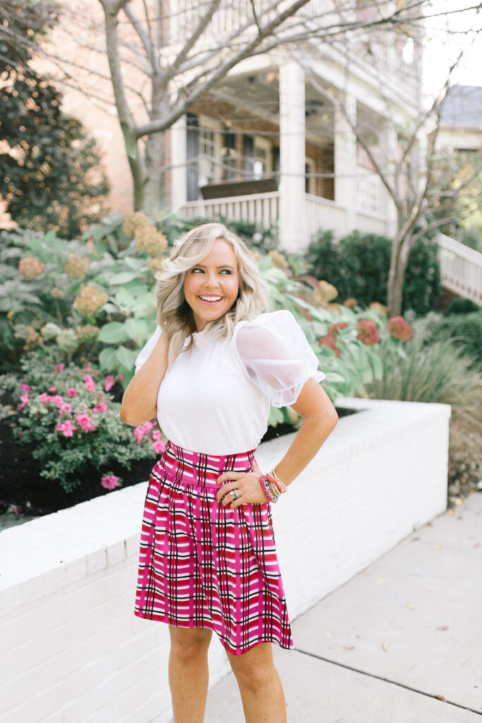 Hi Sugarplum by popular Nashville fashion blog, Hello Happiness: image of Natasha Stoneking wearing aGibson LookPiccadilly Sheer Puff Sleeve Knit Top and Gibson Look Kensington Satin Skirt.
