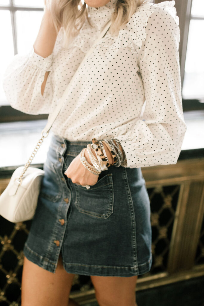 Victoria Emerson Sale by popular Nashville fashion blog, Hello Happiness: image of a woman wearing a Victoria Emerson Gold Attica and Leopard wrap. 