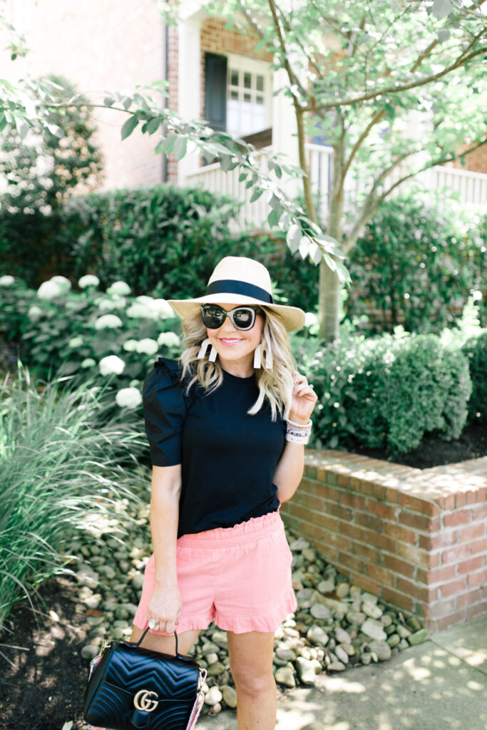 Amazon Favorites by popular Nashville fashion blog, Hello Happiness: image of Natasha Stoneking wearing a Amazon English Factory black ruffle top. 