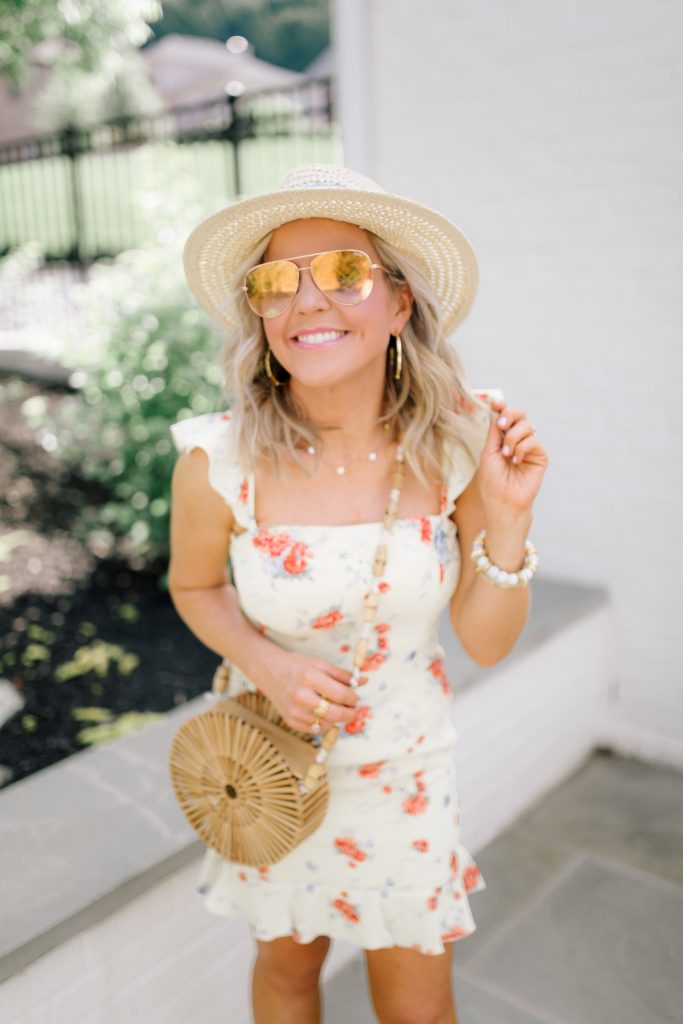 Festival Outfit Ideas featured by top US fashion blog Hello! Happiness; Image of a woman wearing WAYF mini dress, Sole Society wedges, Nordstrom sunglasses and Amazon bag.