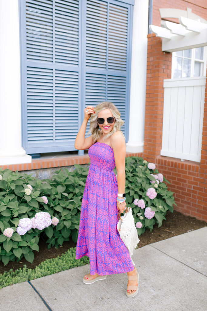 Walmart Scoop by popular Nashville fashion blog, Hello Happiness: image of a woman standing outside and wearing a Walmart Scoop Women’s Smock Top Strapless Printed Maxi Dress, Walmart Quay Women's Gradient Breeze In QW-000378-GLD/BRN Gold Geometric Sunglasses, Walmart Scoop Macrame Wooden Handle Tote Bag, and Walmart Wodstyle Womens Platform Espadrille Sandals Buckle Peep Toe Summer Casual Shoe.