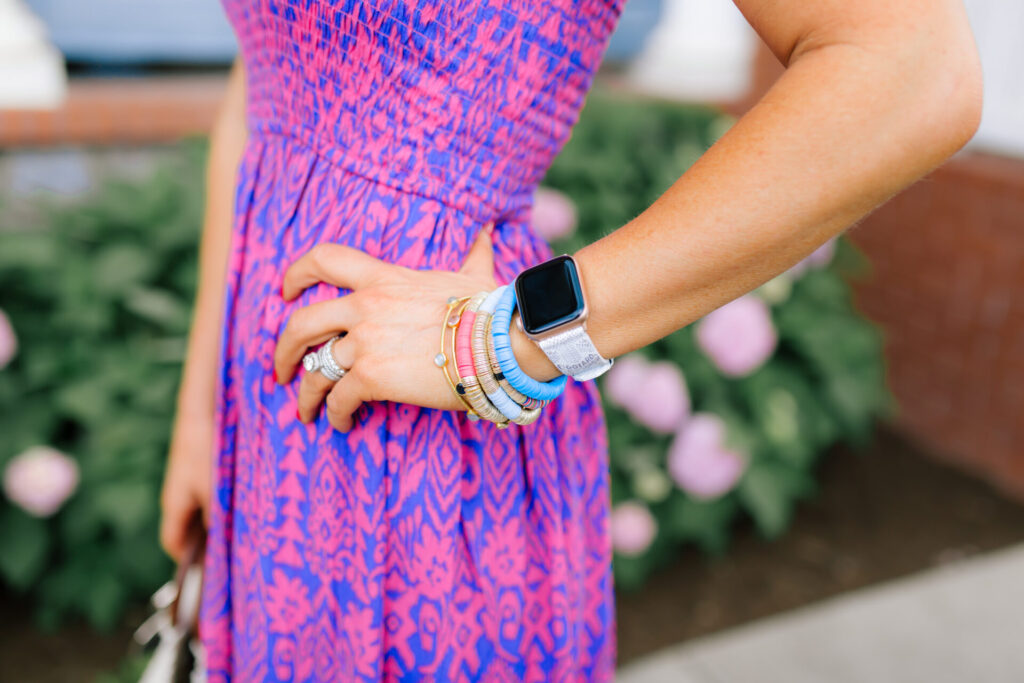 Walmart Scoop by popular Nashville fashion blog, Hello Happiness: image of a woman standing outside and wearing a Walmart Scoop Women’s Smock Top Strapless Printed Maxi Dress, Walmart Quay Women's Gradient Breeze In QW-000378-GLD/BRN Gold Geometric Sunglasses, Walmart Scoop Macrame Wooden Handle Tote Bag, and Walmart Wodstyle Womens Platform Espadrille Sandals Buckle Peep Toe Summer Casual Shoe.