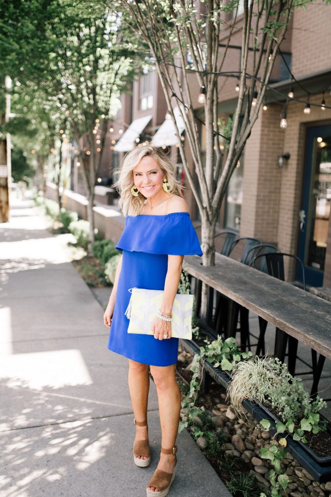 Blue Off the Shoulder Dress featured by top US fashion blog Hello! Happiness; Image of a woman wearing a Charles Henry dress, Marc Fisher wedges and Baublebar earrings.