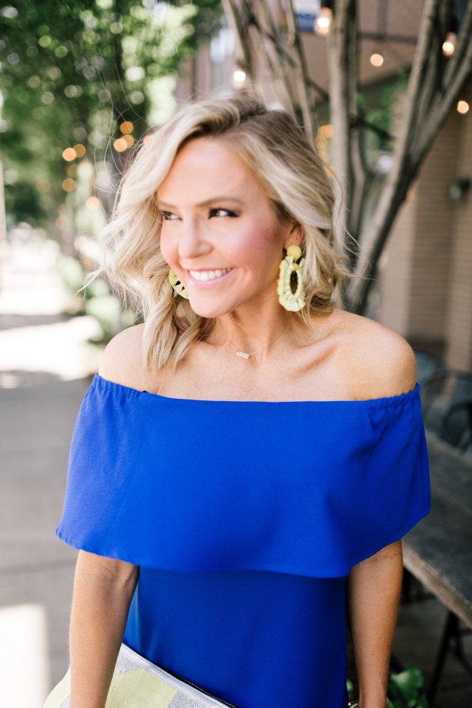 Blue Off the Shoulder Dress featured by top US fashion blog Hello! Happiness; Image of a woman wearing a Charles Henry dress, Marc Fisher wedges and Baublebar earrings.