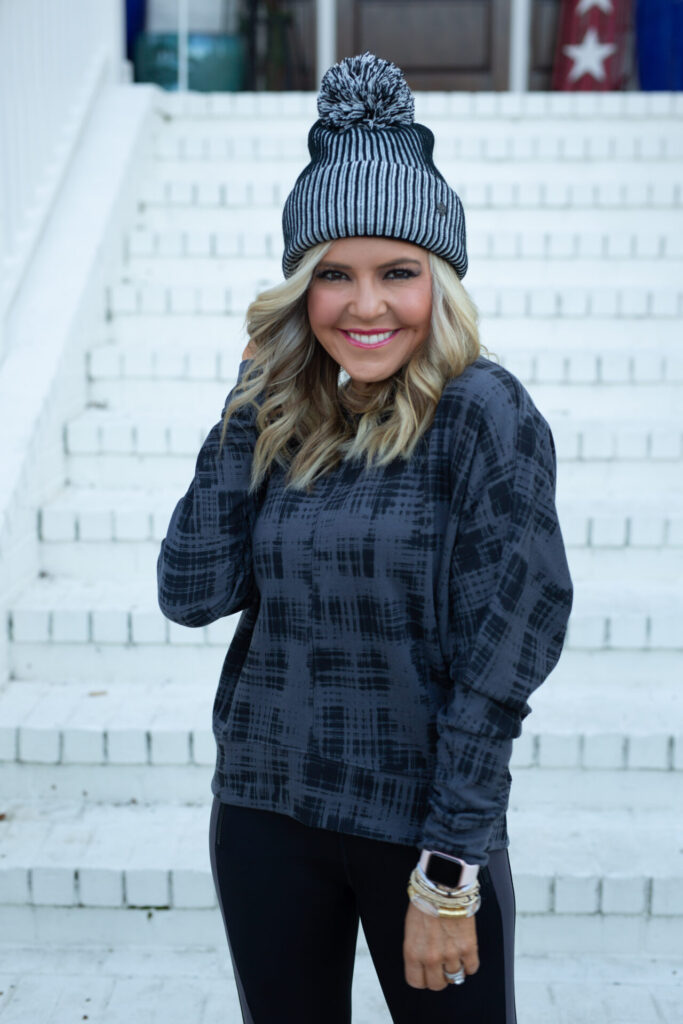 Nordstrom Fashion by popular Nashville fashion blog, Hello Happiness: image of Natasha Stoneking wearing a Nordstrom Zella pom beanie, Nordstrom Zella Carey Crew Hi/Low Sweatshirt, and Zella 7/8 leggings. 