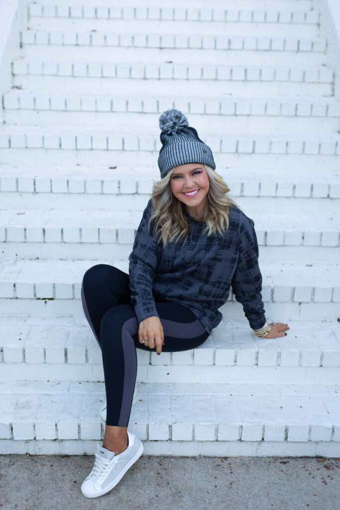 Nordstrom Fashion by popular Nashville fashion blog, Hello Happiness: image of Natasha Stoneking wearing a Nordstrom Zella pom beanie, Nordstrom Zella Carey Crew Hi/Low Sweatshirt, and Zella 7/8 leggings. 