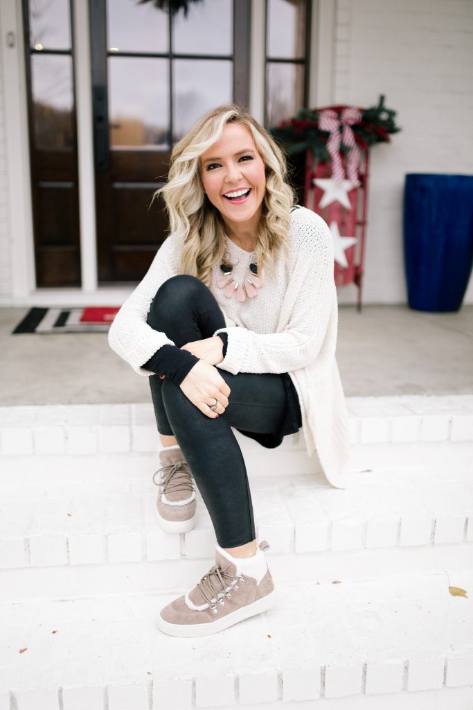 Holiday Gift Guide: Unique Gifts for Travelers featured by top US life and style blog, Hello Happiness | 2019 Holiday Gift Guide: Best Gifts for Travelers by popular Nashville life and style blog, Hello Happiness: image of a woman sitting on her front porch steps. 