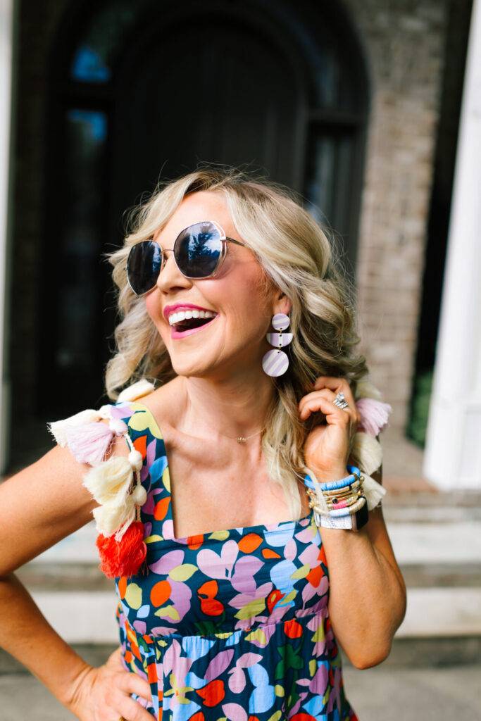 Personal Questions by popular Nashville lifestyle blog, Hello Happiness: image of Natasha Stoneking standing outside and wearing a J.Crew Tassel dress in confetti floral, ShopBop See by Chloe Glyn Wedge Espadrilles, Amazon Deerludie & T Women Bamboo Purse Handbag, and MLDED clay earrings. 