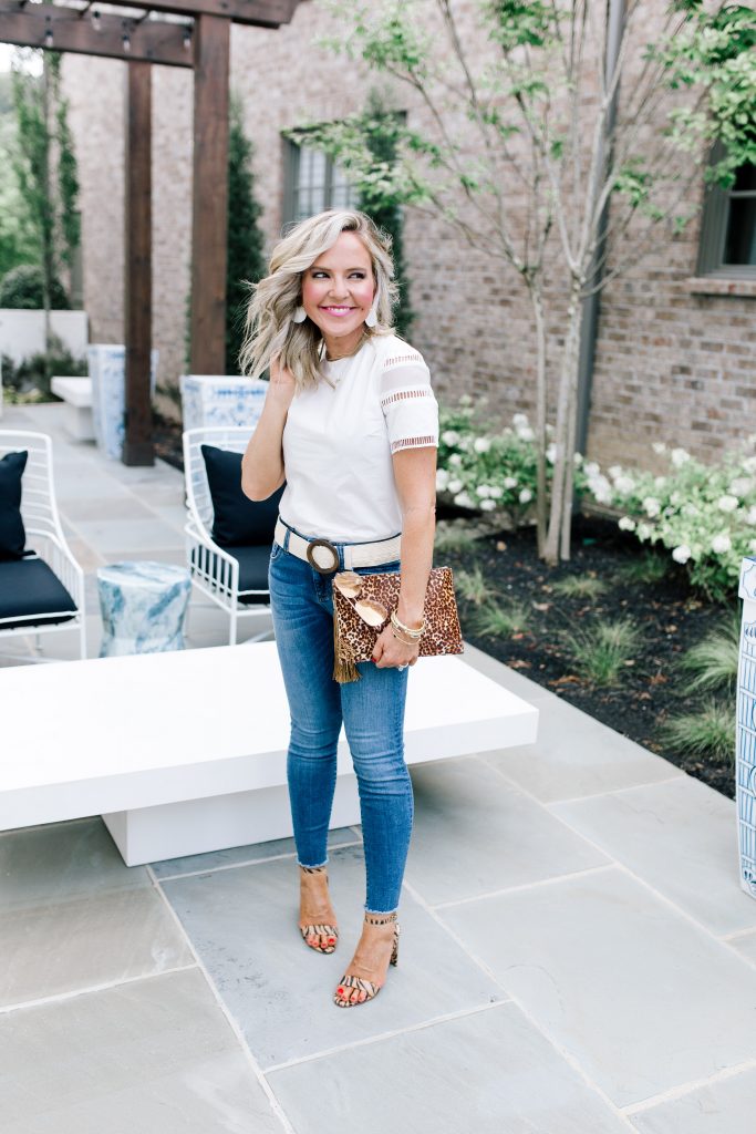 Snakeskin + Leopard...My Vince Camuto Favorites by popular Nashville blog, Hello Happiness: image of a woman outside wearing Vince Camuto  Kresseya High-Heel Sandals and holding a Vince Camuto Iggy Tassel Clutch.