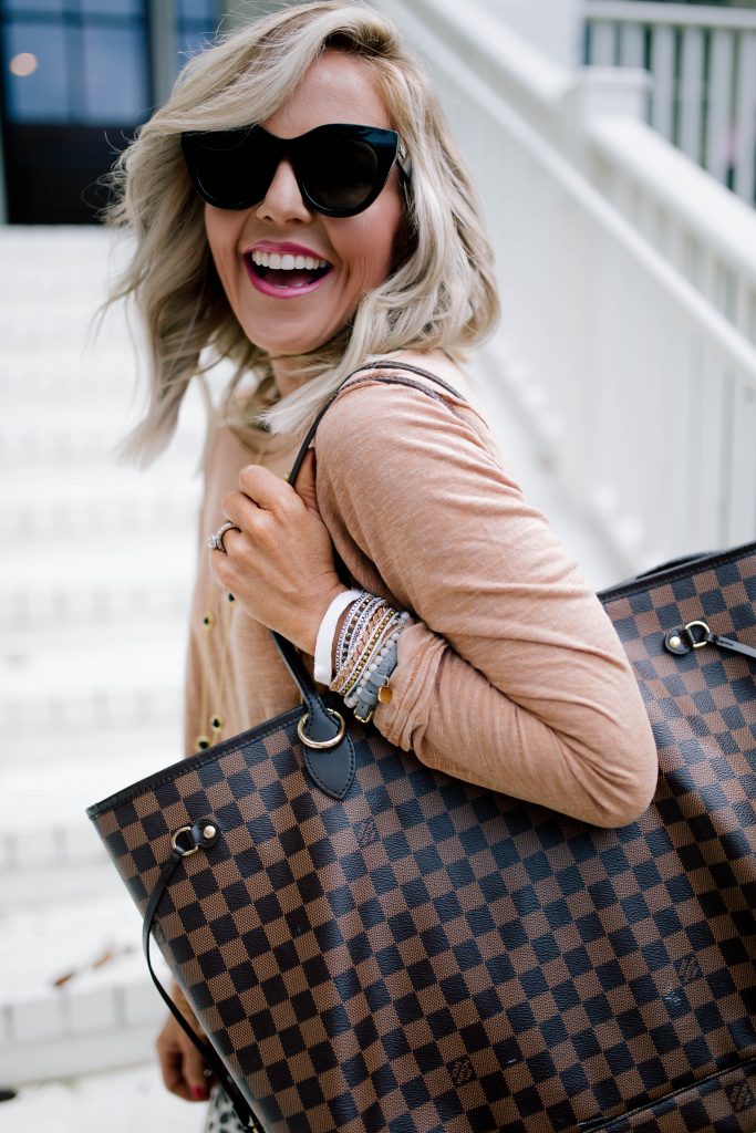 The Perfect Bracelet Stack with Victoria Emerson by popular Nashville fashion blog, Hello Happiness: image of a woman wearing the Victoria Emerson Heart Double Wrap on White bracelet and Gold Dorado on Ivory bracelet.