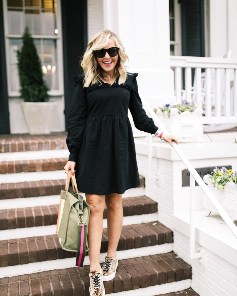 Asos Black Dress by popular Nashville fashion blog, Hello Happiness: image of a woman wearing a Asos Pieces smock dress with frill collar in black, J/Slides NYC HARLING Natural/Black Leopard Pony Leather, Bagging Rights TOTE-ALLY Bag, Red Dress It's My Way Black Gold Smoke Sunglasses QUAY AUSTRALIA, and BaubleBar ANEMONE DROP EARRINGS.