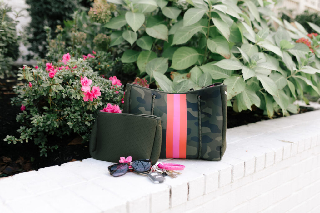 Social Threads by popular Nashville fashion blog, Hello Happiness: image of a Social Threads Hello Happiness Camo Striped Neoprene Tote.