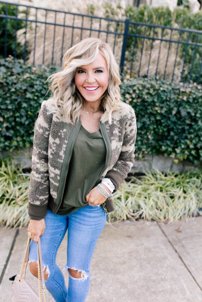 Stack Up with the BOGO Victoria Emerson Holiday Sale! by popular Nashville fashion blog, Hello Happiness: image of a woman wearing a Red Dress Z Supply The Rosin Long Sleeve Pocket Tee, ShopBop Levi's 721 High Rise Distressed Skinny Jeans, Marrakech Camo Sherpa Bomber Jacket, Victoria Emerson WINTER WONDERLAND, and Victoria Emerson APRIL BIRTHSTONE WRAP.