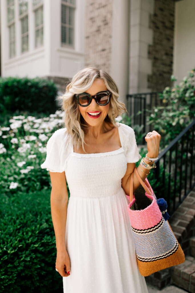 Gibson Look Road Trip by popular Nashville fashion blog, Hello Happiness: image of Natasha Stoneking wearing a Gibsonlook x Hello Happiness Puff Sleeve Smocked Maxi Dress, Hat Attack Large Tuscan Tote, ShopBop See by Chloe Glyn Wedge Espadrilles, Amazon Freckles Mark sunglasses and ShopBop Shashi Bloom Earrings.  