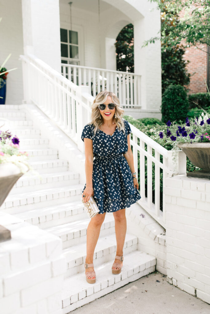Gibson Look Road Trip by popular Nashville fashion blog, Hello Happiness: image of Natasha Stoneking wearing a Gibsonlook x Jess Fay Smocked Detail V Neck Blouse, Gibsonlook x Jess Fay Tiered Skirt, See by Chloe Kristy heel sandals, Hat Attack Jewel Box clutch, Quay Big Love glasses, and BaubleBar BIRCH DROP EARRINGS. 