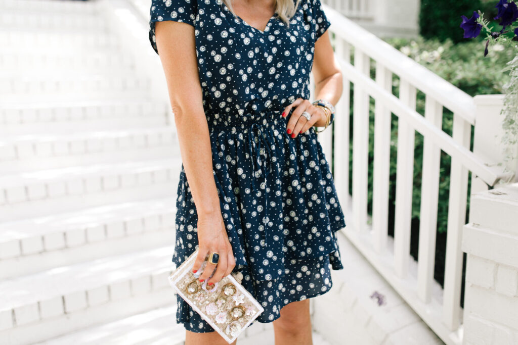 Gibson Look Road Trip by popular Nashville fashion blog, Hello Happiness: image of Natasha Stoneking wearing a Gibsonlook x Jess Fay Smocked Detail V Neck Blouse, Gibsonlook x Jess Fay Tiered Skirt, See by Chloe Kristy heel sandals, Hat Attack Jewel Box clutch, Quay Big Love glasses, and BaubleBar BIRCH DROP EARRINGS. 