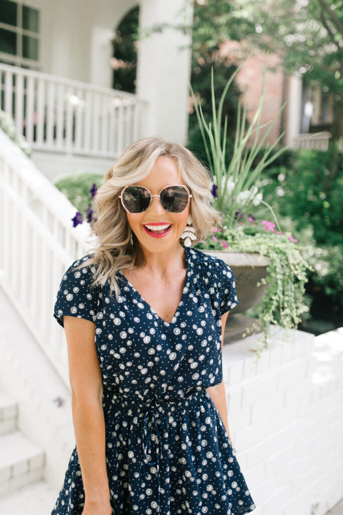 Gibson Look Road Trip by popular Nashville fashion blog, Hello Happiness: image of Natasha Stoneking wearing a Gibsonlook x Jess Fay Smocked Detail V Neck Blouse, Gibsonlook x Jess Fay Tiered Skirt, See by Chloe Kristy heel sandals, Hat Attack Jewel Box clutch, Quay Big Love glasses, and BaubleBar BIRCH DROP EARRINGS. 