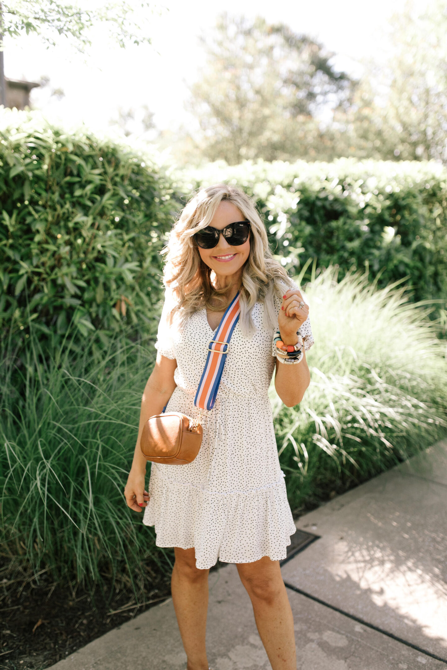 Bag Straps by popular Nashville fashion blog, Hello Happiness:image of Natasha Stoneking carrying a bag with a Social Threads bag strap. 