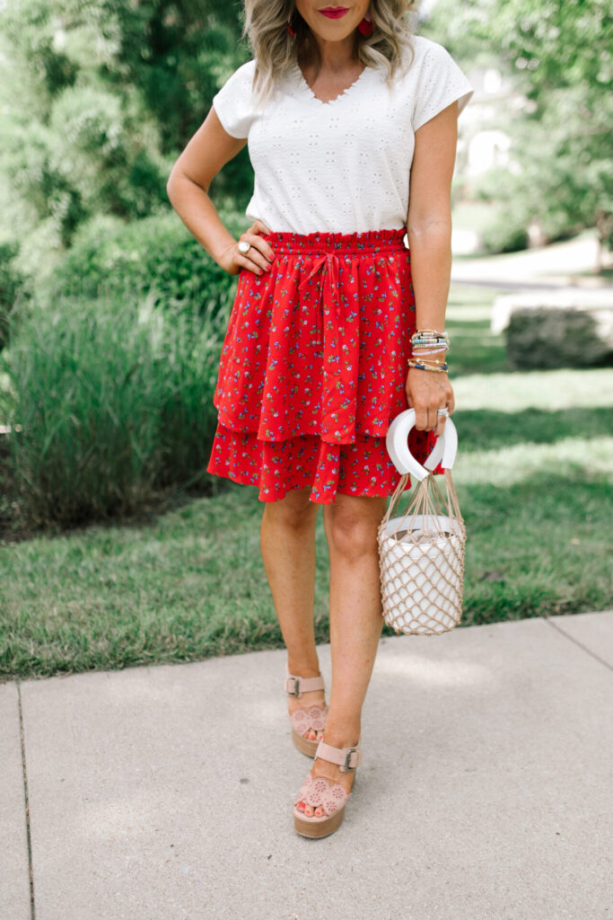 Gibson Look Road Trip by popular Nashville fashion blog, Hello Happiness: image of Natasha Stoneking wearing a Gibsonlook x Jess Fay V-Neck Ruffle Trim Eyelet Tee, Gibsonlook x Jess Fay Tiered Skirt, See by Chloe Kristy heel sandals, Amazon Miuco Women Nets Bucket Handbag, Amazon SOJOS Heart Shaped Sunglasses, and Amazon LIXIN YIQING 14K Gold Statement Drop Earrings.