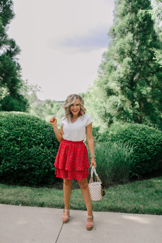 Gibson Look Road Trip by popular Nashville fashion blog, Hello Happiness: image of Natasha Stoneking wearing a Gibsonlook x Jess Fay V-Neck Ruffle Trim Eyelet Tee, Gibsonlook x Jess Fay Tiered Skirt, See by Chloe Kristy heel sandals, Amazon Miuco Women Nets Bucket Handbag, Amazon SOJOS Heart Shaped Sunglasses, and Amazon LIXIN YIQING 14K Gold Statement Drop Earrings.