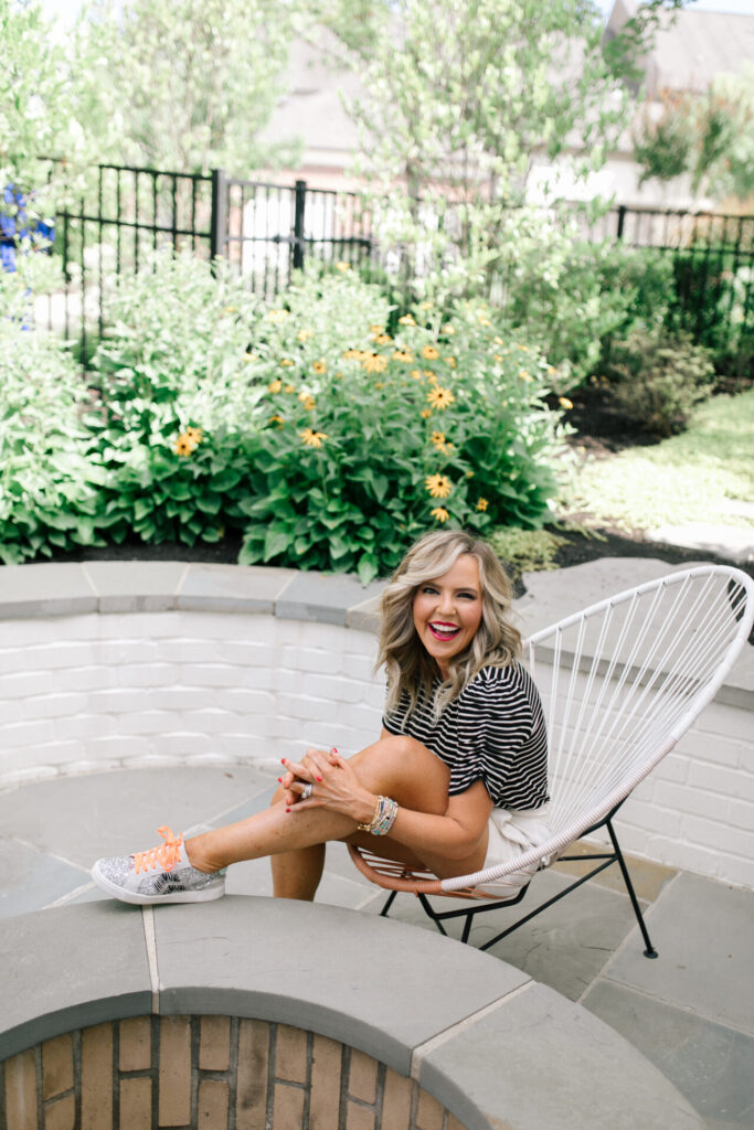 Gibson Look Road Trip by popular Nashville fashion blog, Hello Happiness: image of Natasha Stoneking wearing a Gibsonlook x DTKAustin Puff Sleeve Soft Tee, Freckles Mark Butterfly Sunglasses Semi Cat Eye Glasses, Ann Taylor The Marina Tie Waist Short, Gucci black GG Marmont small top handle bag, ZAGA SNEAKERS IN SILVER, and Social Threads Bag Strap.