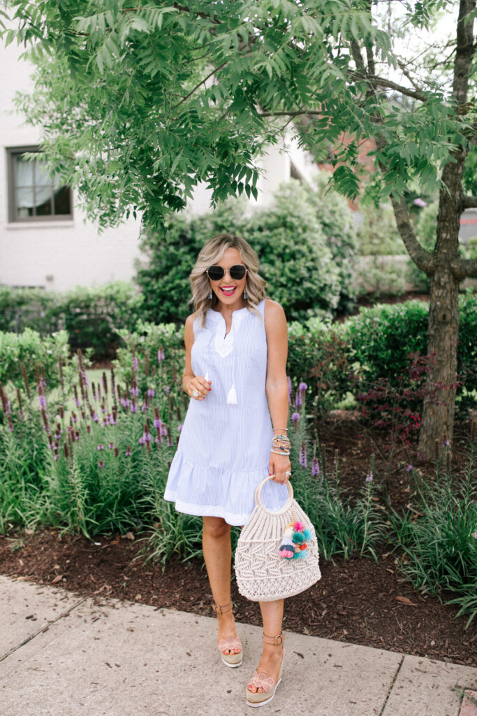 Sail to Sable by popular Nashville fashion blog, Hello Happiness: image of Natasha Stoneking wearing a Sail to Sable SLEEVELESS RUFFLE HEM DRESS, Quay Big Love sunglasses, Amazon See by Chloe See by Chloe Women's Glyn Wedge Espadrilles, and holding a HatAttack Cotton Cord Bag with a Amazon I-BOSOM Colorful Boho Pom Pom Tassel Bag Charm Key Chain.