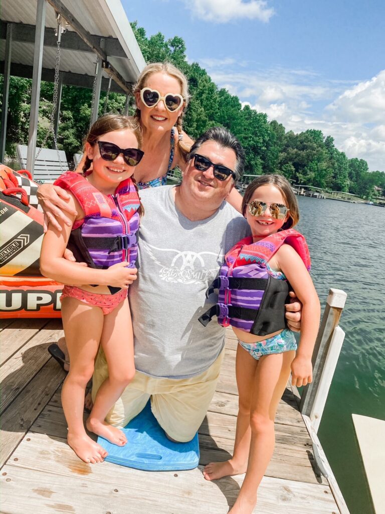Year in Review by popular Nashville lifestyle blog, Hello Happiness: image of two young girls standing together on a boating dock. 