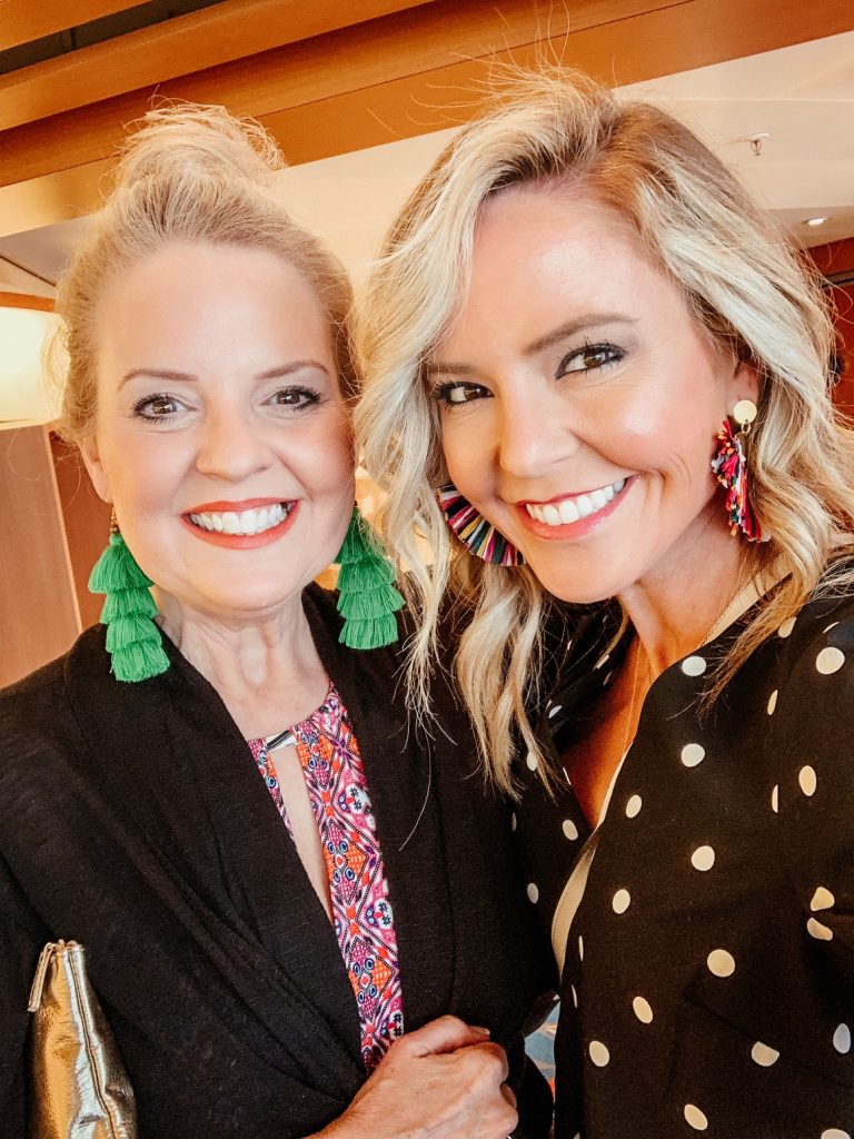 Disney Cruise Review... Set Sail with Mickey and Friends featured by top US travel blog, Hello! Happiness; image of woman wearing a black polka dot dress and earrings